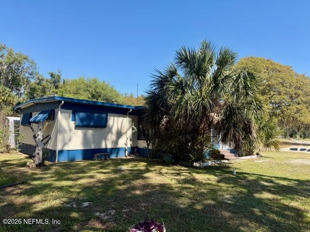 126 Golf Course Lane Crescent City, FL 32112 - Photo 4 of 23 a view of a house with a yard