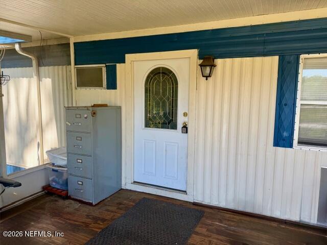 126 Golf Course Lane Crescent City, FL 32112 - Photo 7 of 23 a view of walk in closet with fireplace and window