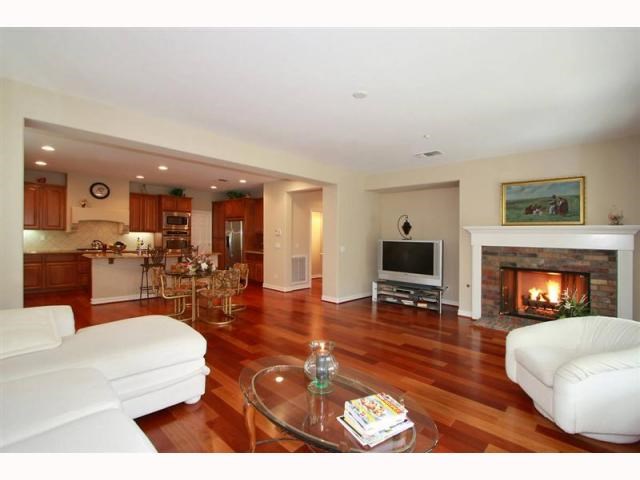 a living room with furniture and a fireplace or television