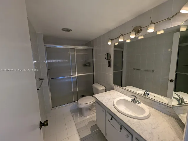 a bathroom with a tub and a sink