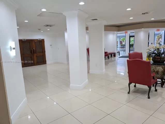 a view of a livingroom with furniture and a potted plant