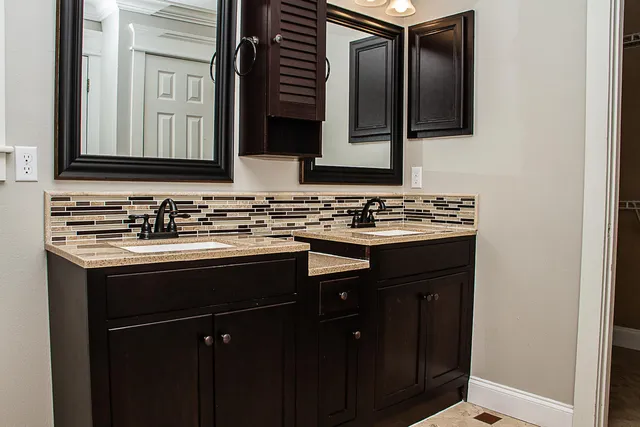 a bathroom with a shower a toilet and a sink