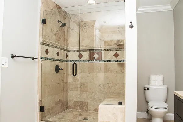 a backyard of a house with lots of green space and fountain in the back