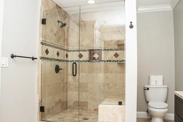 a backyard of a house with lots of green space and fountain in the back