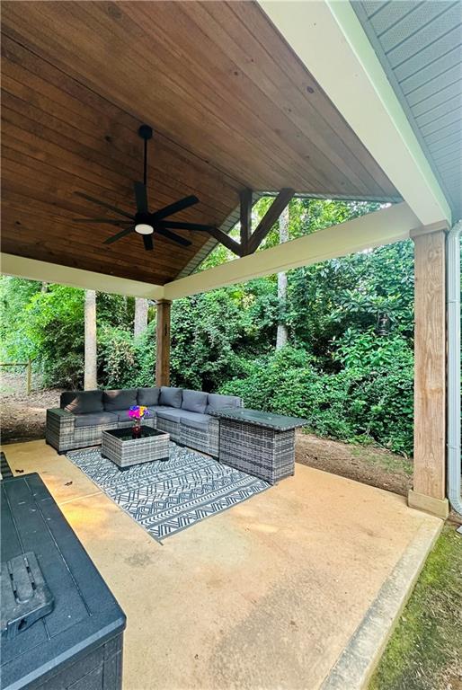 815 Poplar Street Monticello, GA 31064 - Photo 20 of 33 a view of a backyard with table and chairs under an umbrella