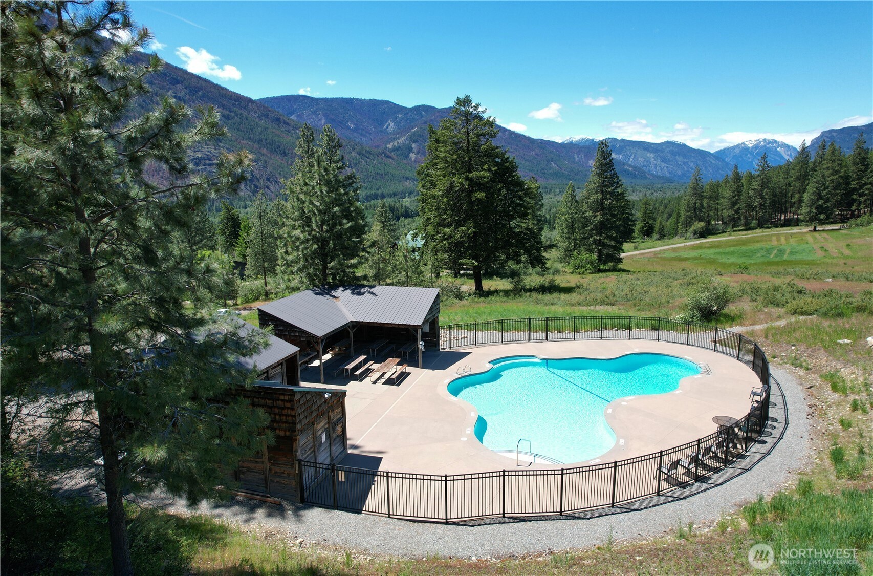 94 Homestead Road Winthrop, WA 98862 - Photo 26 of 26 an aerial view of a house with outdoor space swimming pool and mountains