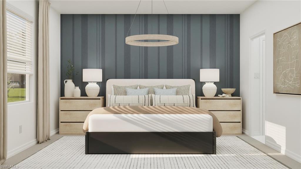 14895 Bluewater Road Babcock Ranch, FL 33982 - Photo 12 of 27 a bedroom with a bed and a table