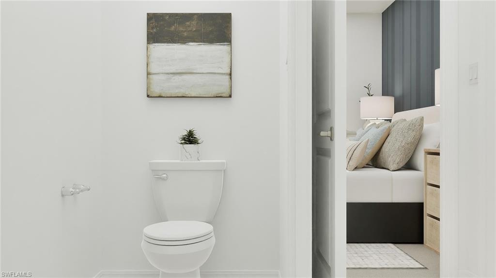 14895 Bluewater Road Babcock Ranch, FL 33982 - Photo 15 of 27 a bathroom with a toilet and a sink
