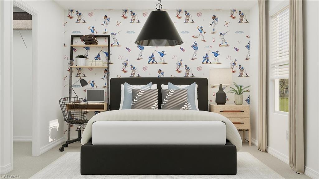 14895 Bluewater Road Babcock Ranch, FL 33982 - Photo 17 of 27 a bedroom with a bed and a lamp on the dresser