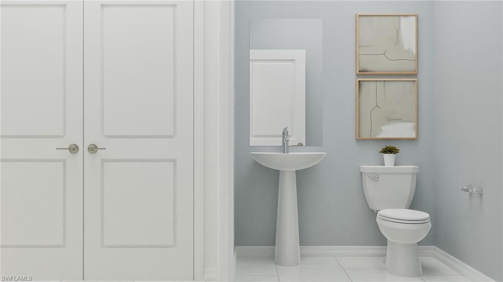 14895 Bluewater Road Babcock Ranch, FL 33982 - Photo 23 of 27 a bathroom with a toilet sink