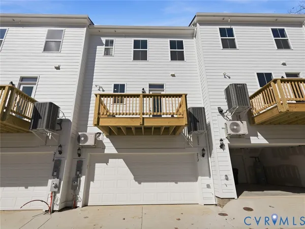 a view of a house with wooden deck