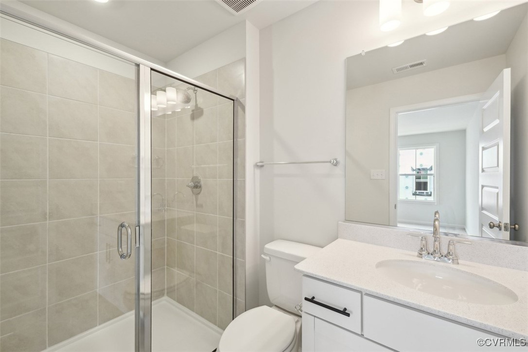 212 That Way Midlothian, VA 23114 - Photo 18 of 37 a bathroom with a granite countertop sink toilet and shower