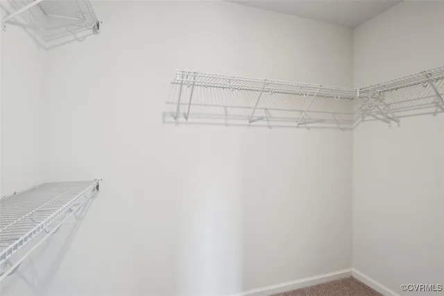 a view of an empty room and a window