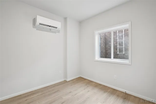 an empty room with wooden floor