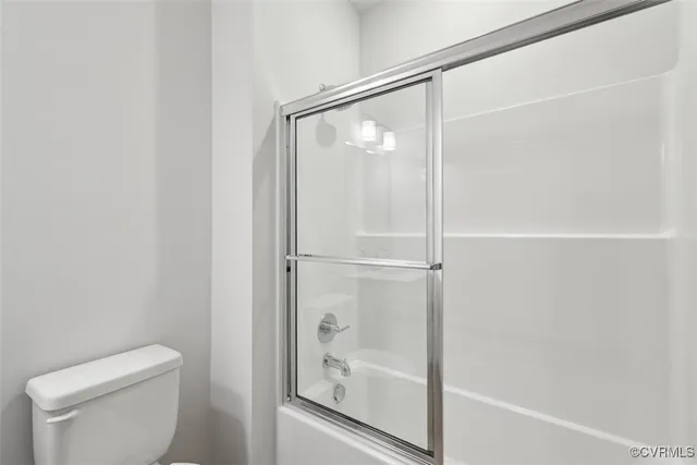a bathroom with a sink toilet and vanity