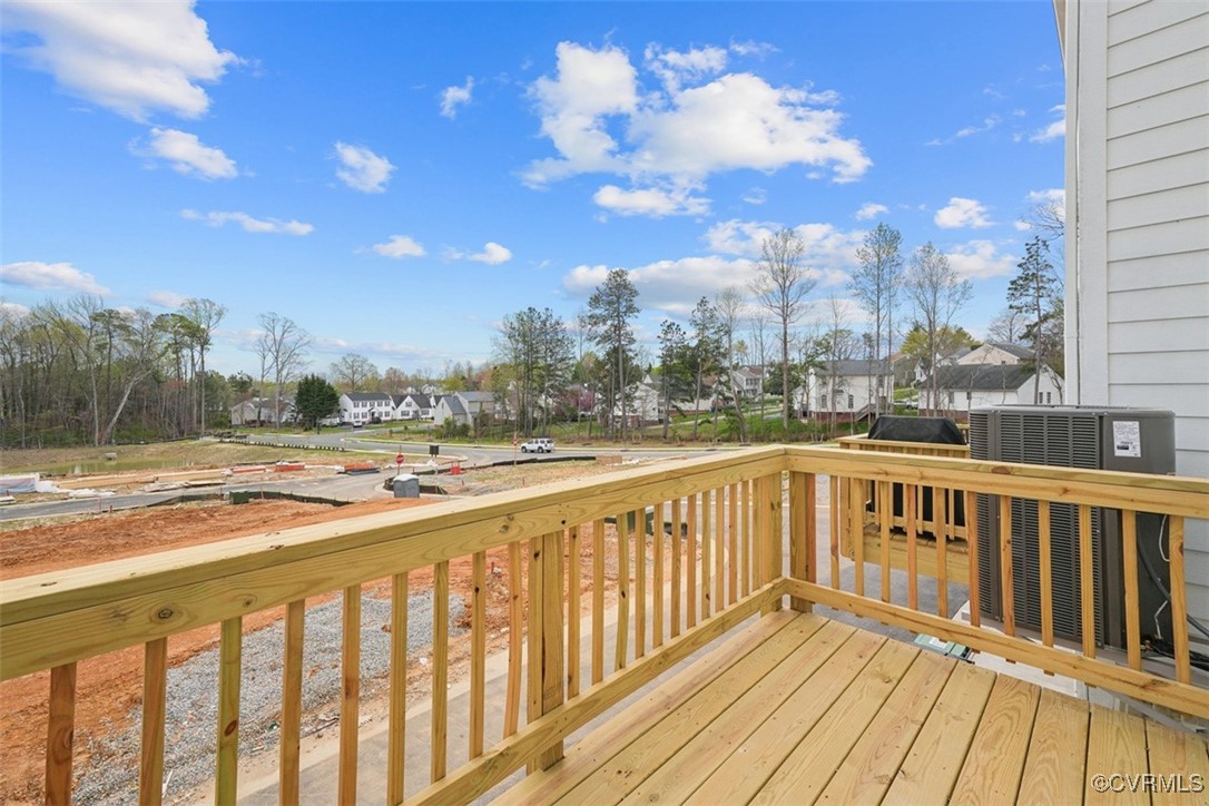 212 That Way Midlothian, VA 23114 - Photo 31 of 37 a view of a balcony with wooden floor and city view