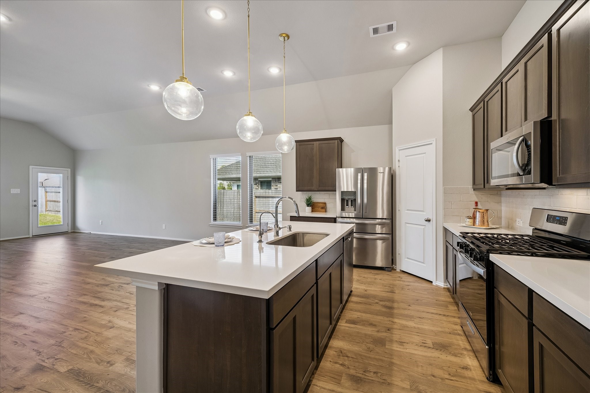 3212 Bright Maple Dr Spring Spring, TX 77386 - Photo 8 of 28 42 inch cabinets provide spacious storage room for all your dishes and cookware. The lighting is abundant; there is recessed lighting as well as beautiful pendant lights over the huge island.