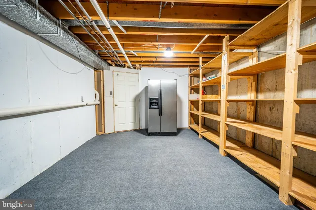 a view of an empty room with wooden walls