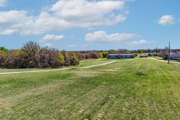 a view of a golf course with a lake