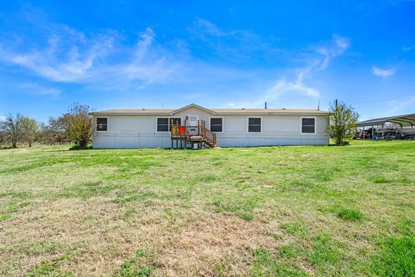 a view of a house with a back yard