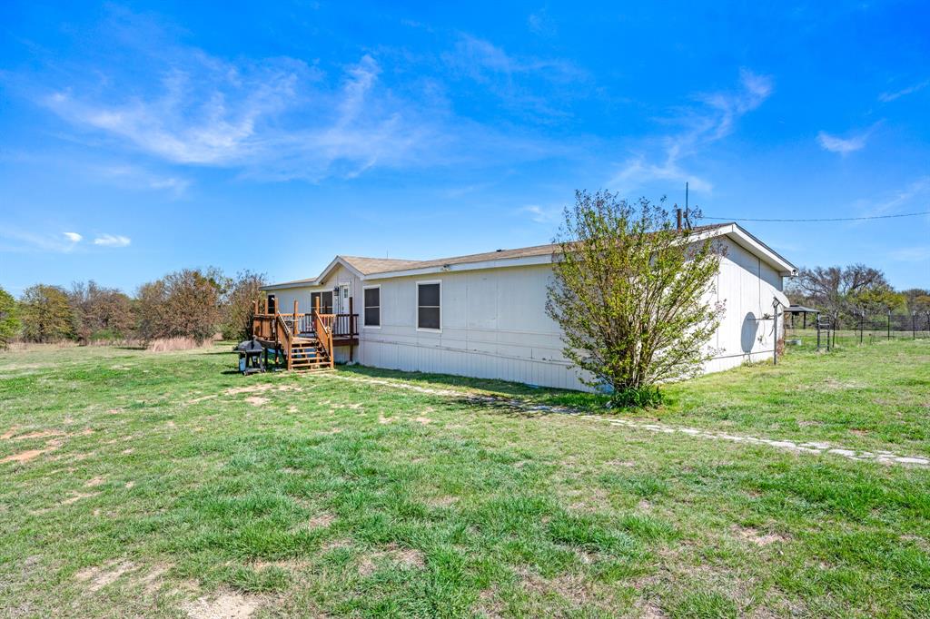 1536 New Hope Road Boyd, TX 76023 - Photo 13 of 40 a view of a house with a back yard