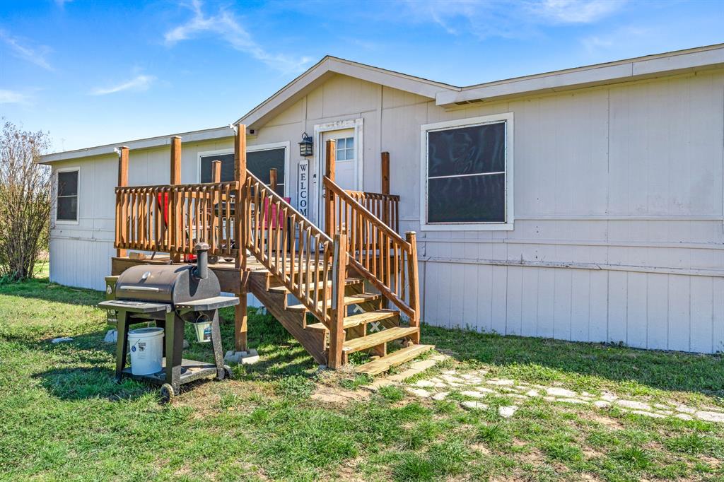 1536 New Hope Road Boyd, TX 76023 - Photo 14 of 40 a view of a house with backyard and porch