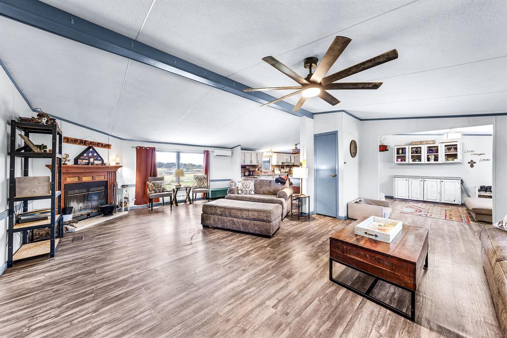 1536 New Hope Road Boyd, TX 76023 - Photo 21 of 40 a living room with furniture and a wooden floor