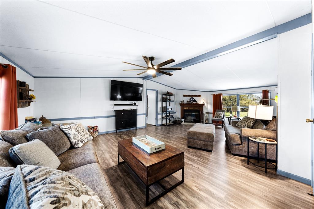 1536 New Hope Road Boyd, TX 76023 - Photo 23 of 40 a living room with furniture and a flat screen tv