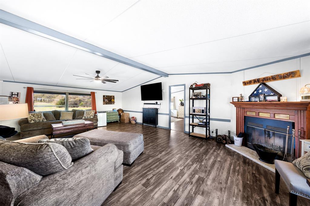 1536 New Hope Road Boyd, TX 76023 - Photo 24 of 40 a living room with furniture and a fireplace