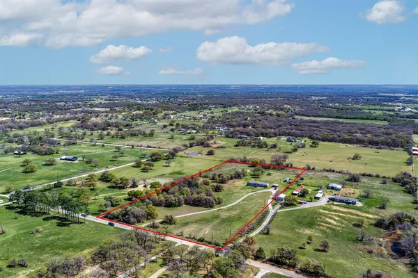 a view of a city with mountains in the background