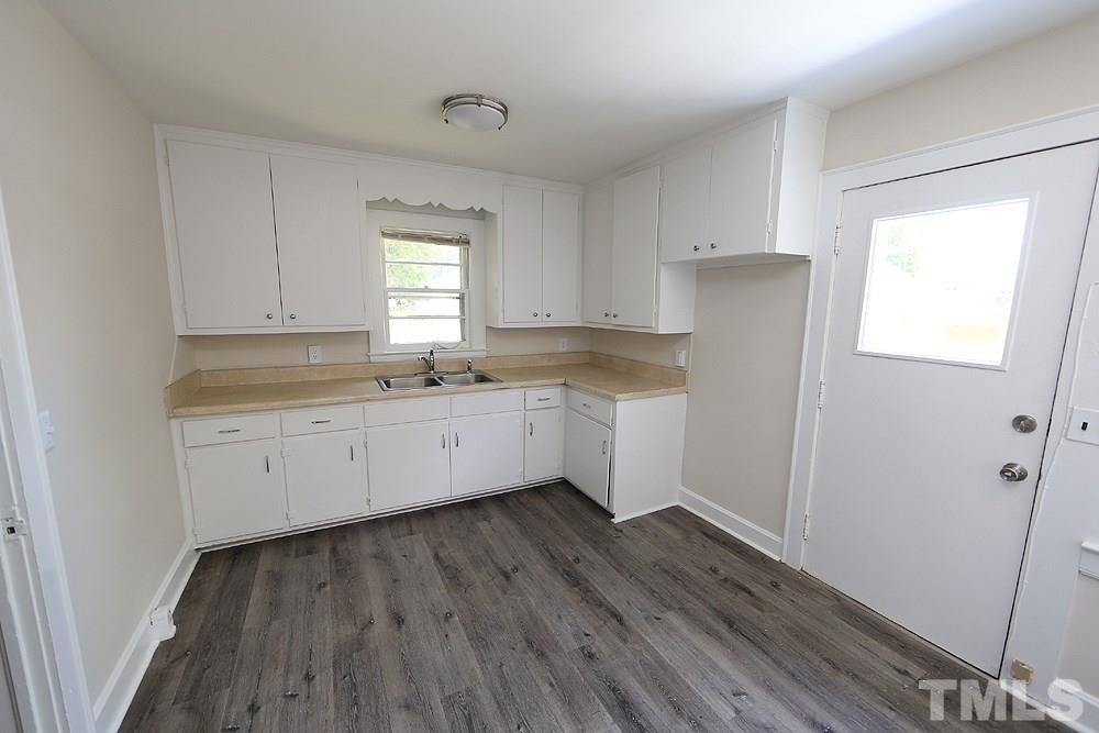 3644 Guess Road Durham, NC 27705 - Photo 3 of 14 The kitchen has been brightened up with new flooring and freshly painted cabinets.