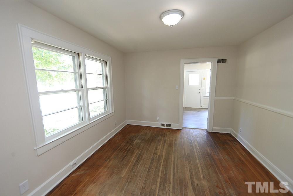 3644 Guess Road Durham, NC 27705 - Photo 6 of 14 This well-lit room off the kitchen can serve as a formal living room or office/study.