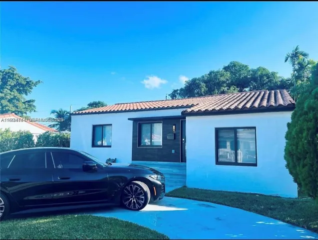a house view with a garden space