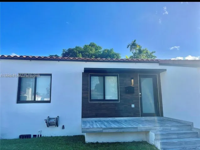 a house view with a garden space