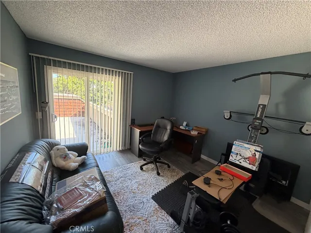 a bedroom with furniture and a window