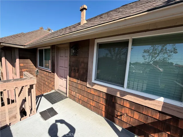 a view of a balcony with a potted plant