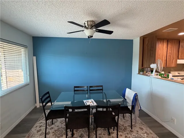 a view of a workspace with furniture and window