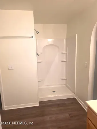 a bathroom with a bath tub