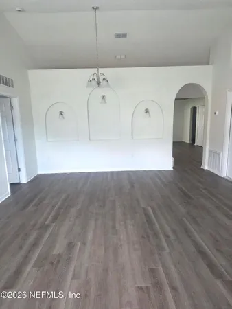 a view of a livingroom with wooden floor