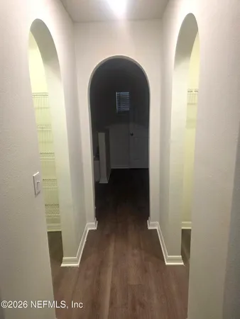 a view of a bedroom from a hallway