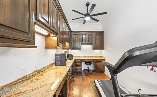 a dining room with furniture and a floor to ceiling window