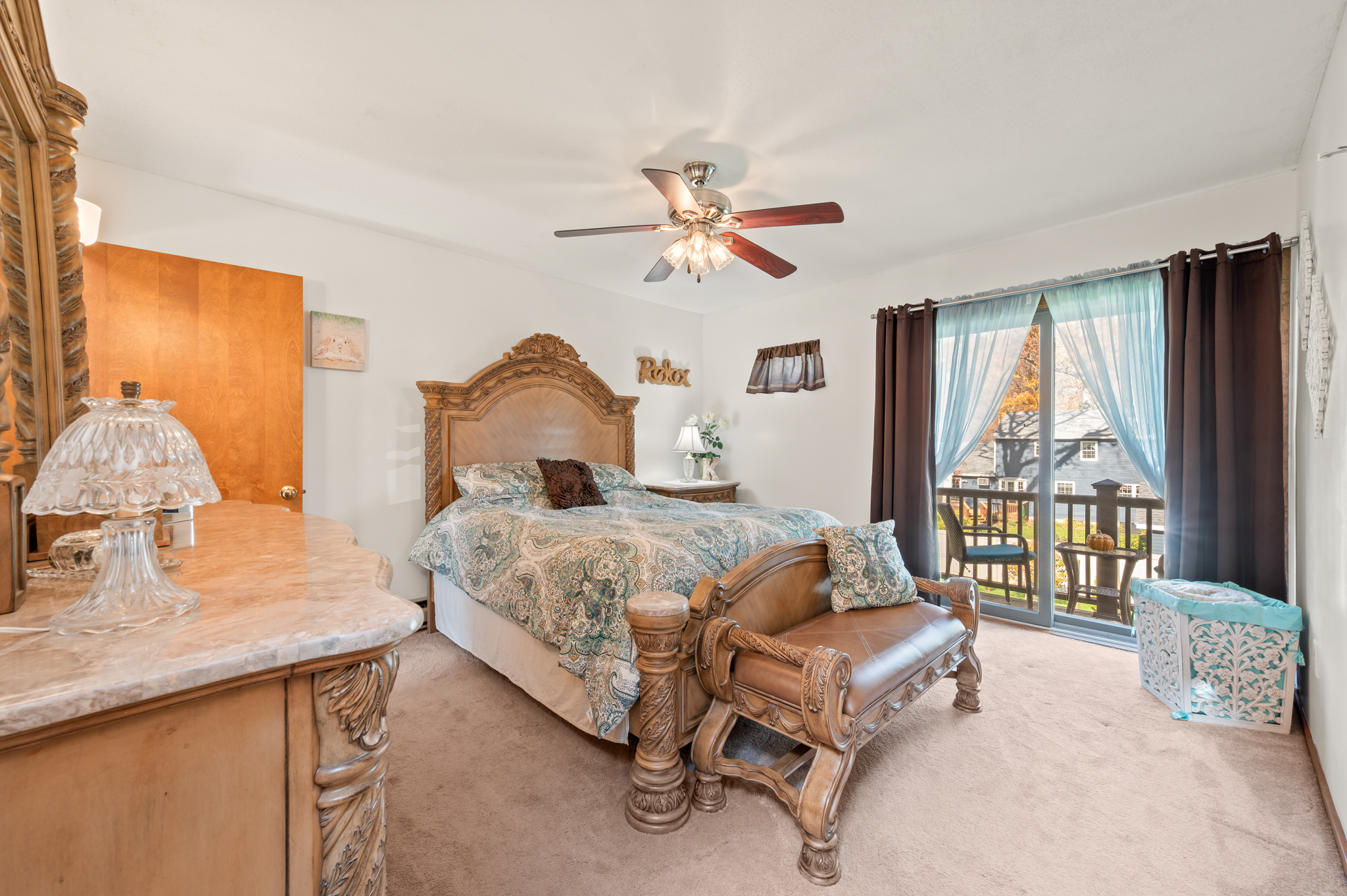 14 Inwood Lane Bristol, CT 06010 - Photo 15 of 40 a bedroom with a large bed and a chandelier