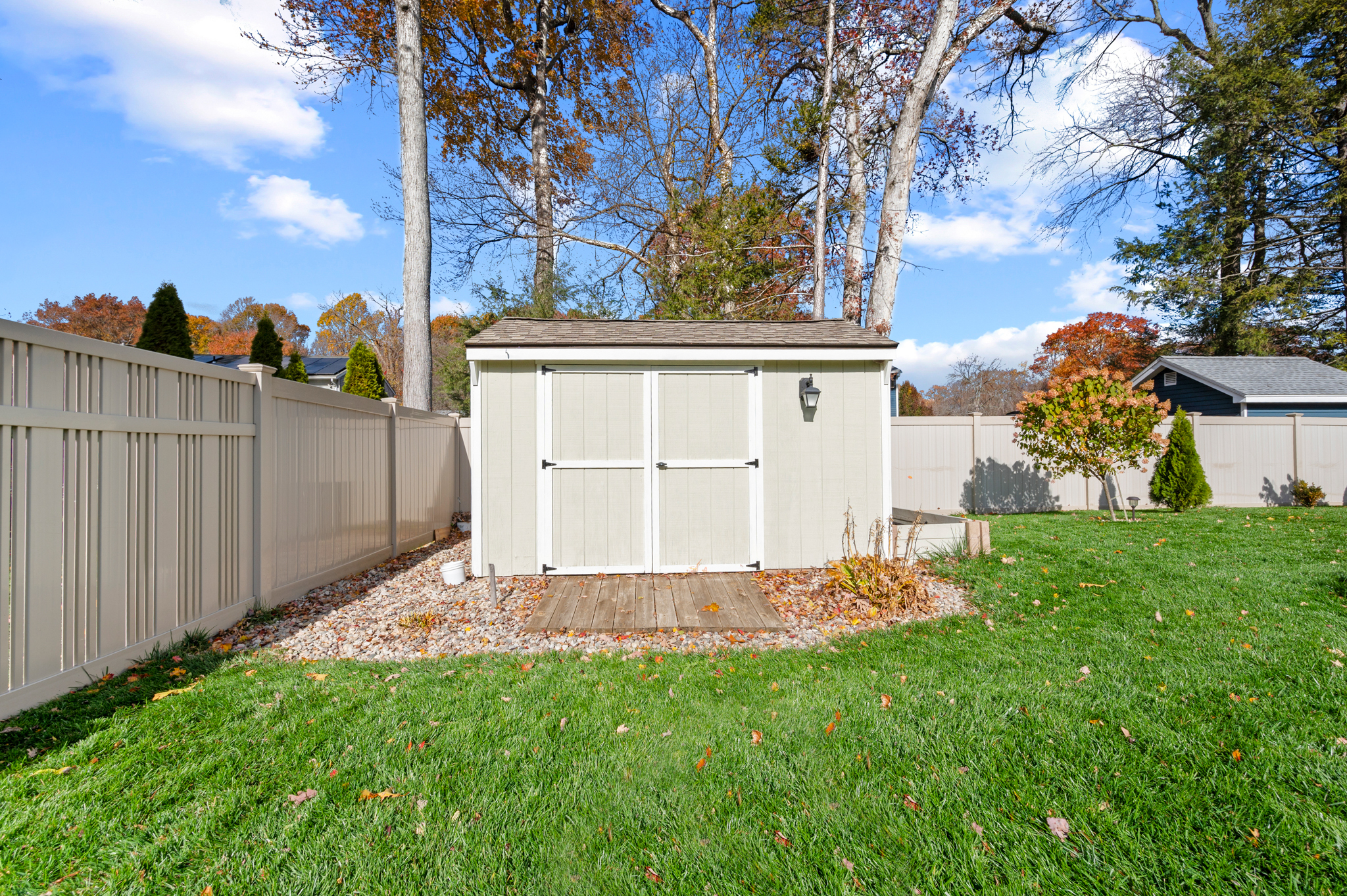 14 Inwood Lane Bristol, CT 06010 - Photo 38 of 40 a view of a backyard with wooden fence and a bench