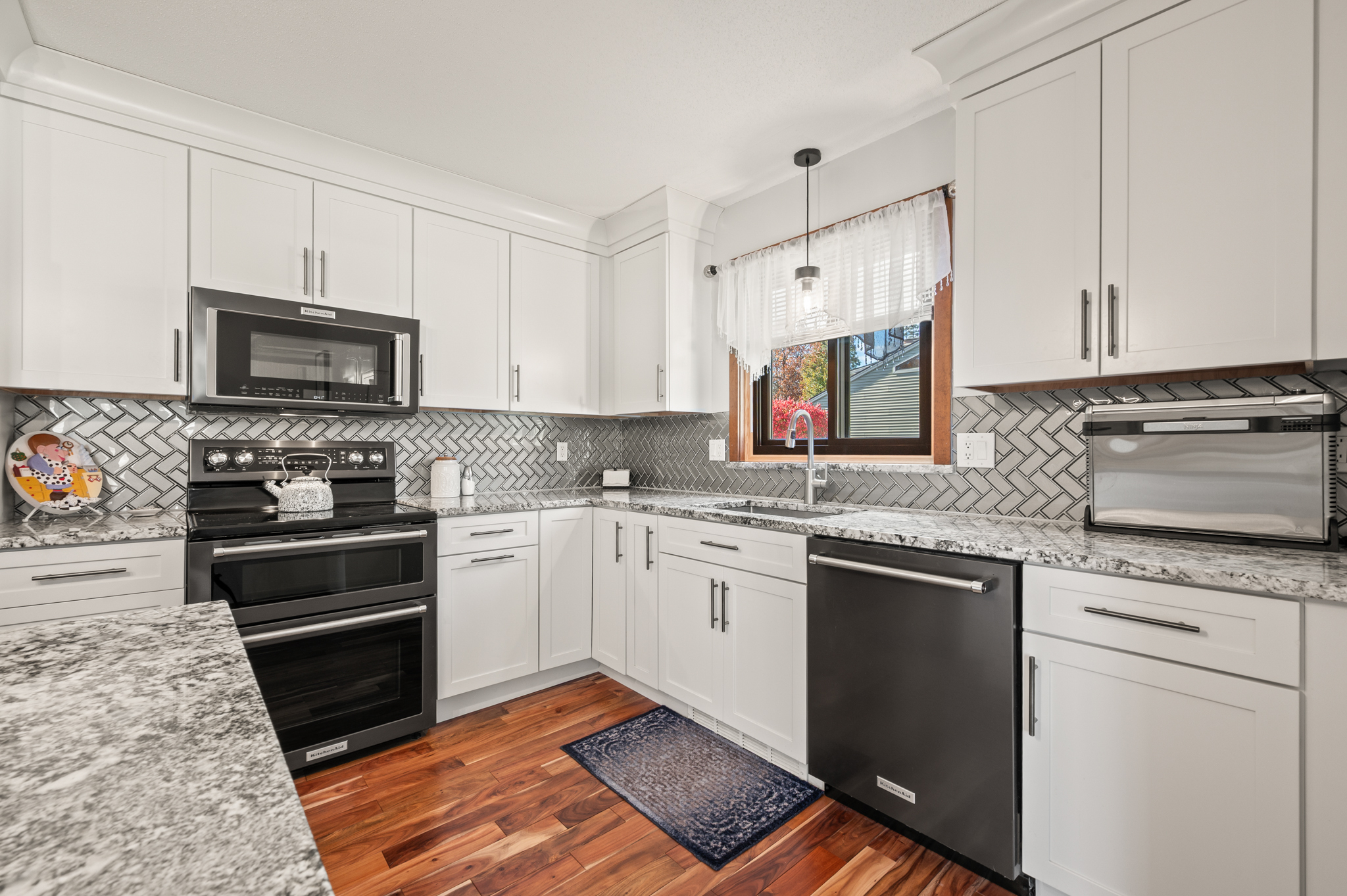 14 Inwood Lane Bristol, CT 06010 - Photo 8 of 40 a kitchen with granite countertop a stove sink and cabinets