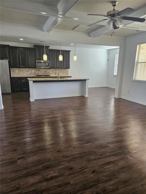 90 Partridge Drive Covington, GA 30016 - Photo 12 of 38 a view of kitchen with cabinets and wooden floor