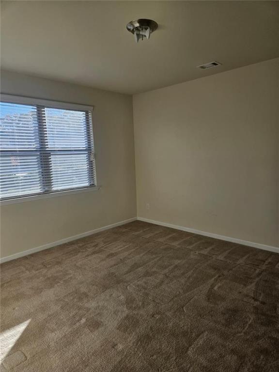 90 Partridge Drive Covington, GA 30016 - Photo 16 of 38 an empty room with a window