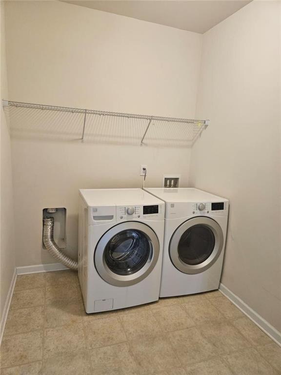 90 Partridge Drive Covington, GA 30016 - Photo 18 of 38 a utility room with dryer and washer