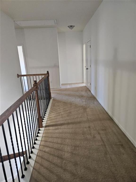 90 Partridge Drive Covington, GA 30016 - Photo 21 of 38 a view of a hallway with wooden floor and staircase