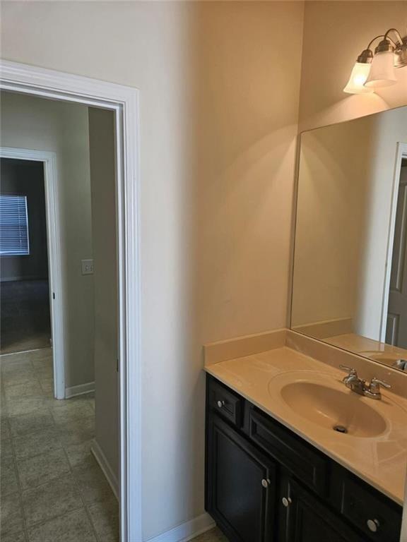 90 Partridge Drive Covington, GA 30016 - Photo 23 of 38 a bathroom with a sink and a mirror
