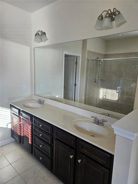 90 Partridge Drive Covington, GA 30016 - Photo 25 of 38 a bathroom with a sink double vanity and a mirror